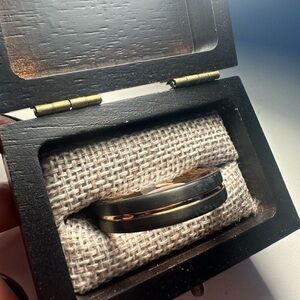 Black and Gold Watch with Polished Finish and Textured Fabric